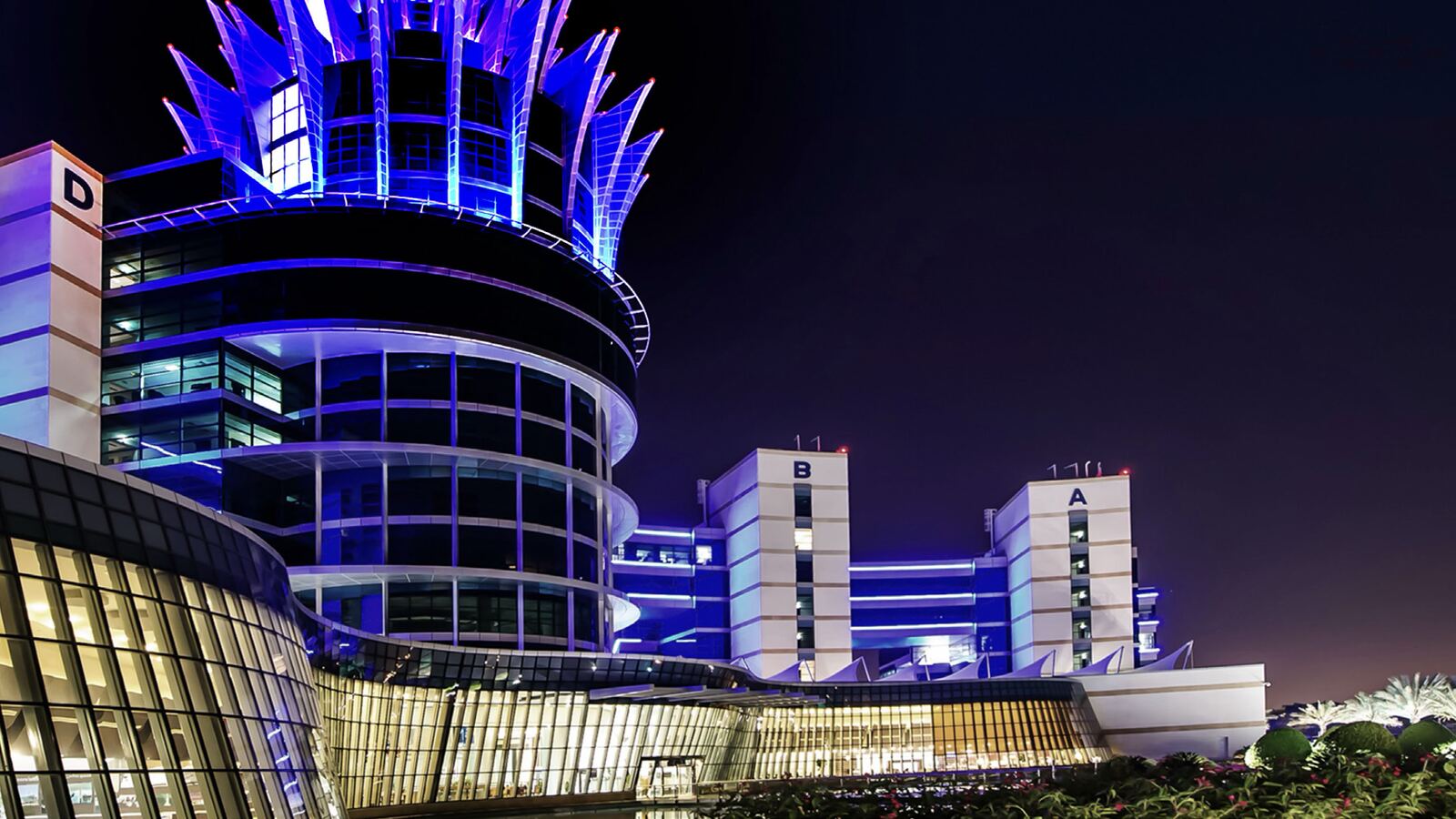 An illuminated Dubai Silicon Oasis building at night