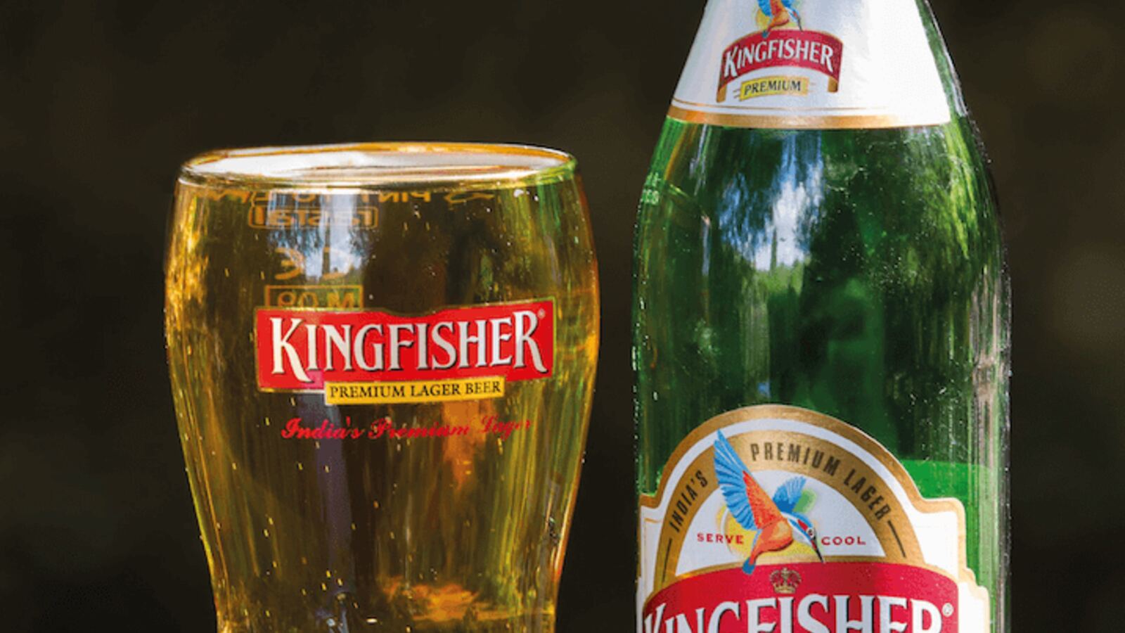 A glass and bottle of Kingfisher beer